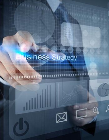 businessman hand points to business strategy as concept